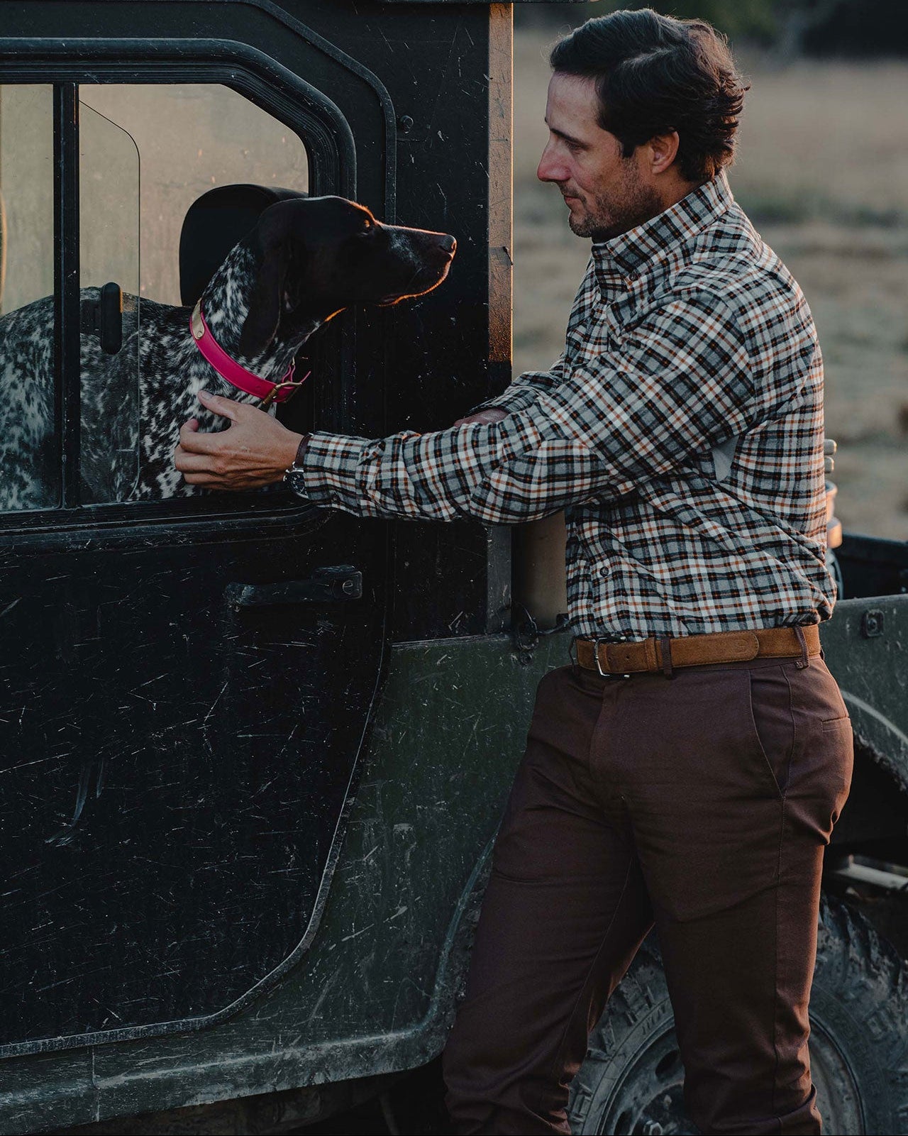 Man with dog in Heritage Pant and Sportsman Shirt